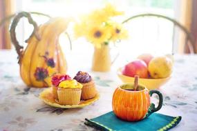 cream cakes with tea on the table