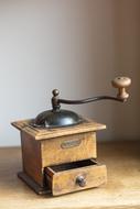 wooden old coffee grinder on the table