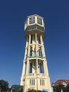 yellow tower on a blue background