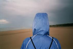 human in blue cloth on Beach