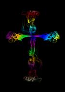 colored burning cross in the dark