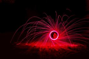 movement of red light in a person hands