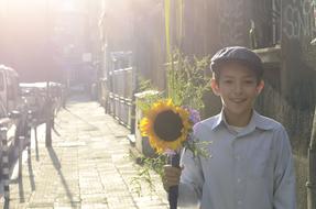 school boy with cute bouquet