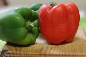 green and red peppers on the table
