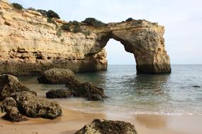 stone arch of a rock in the sea