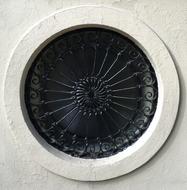 metal rose on a building in Great Jones Street, New York