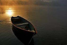 wooden boat on the sunlit sea