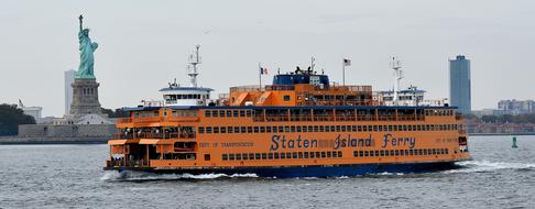 orange ship in the river