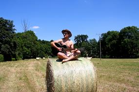 Guitar Player Musicia straw bales