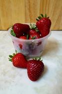 sweet strawberries in plastic cup