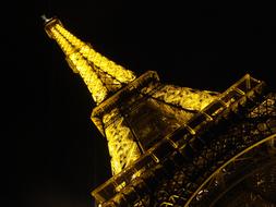 illumined Eiffel Tower at night, France