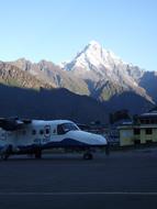 plane against the mountains