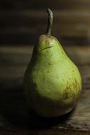 Beautiful green and brown pear in light