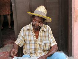 elderly black man with glasses in Cuba