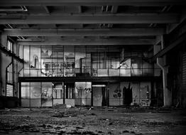 Black and white photo of the beautiful, old, abandoned factory with windows