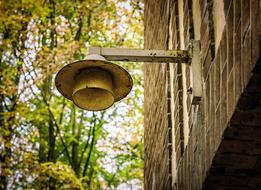 Beautiful lantern on the building, near the colorful and beautiful plants