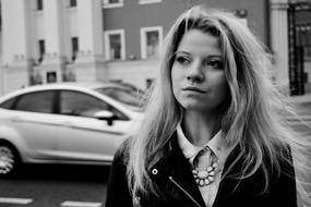 monochrome photo of a sad blonde on a city street