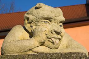 stone sculpture with tongue