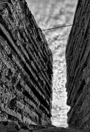 black and white photo of the stone walls of the fort