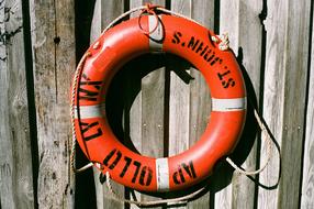 nautical rescue circle on a wooden fence