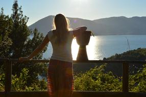 young Girl looks at scenic landscape