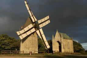 mill with a castle in the field