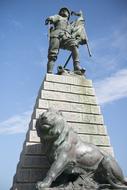 stone statue of a lion on a pillar