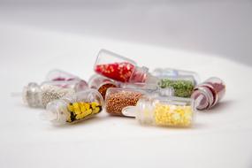 small glass jars with colored decorations