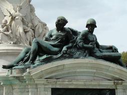 statues at the top of the building