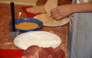 man cooks meat