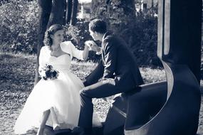 the wedding couple on the bench