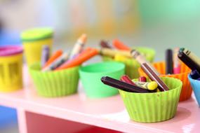 colored crayons for drawing on the table