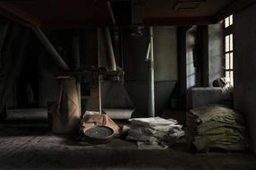 Interior of the dark room with the light through the window