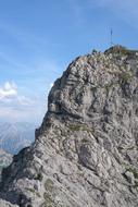 high mountain with the sky in the background
