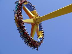 giant frisbee with people in the amusement park