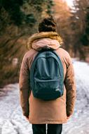 Man with Backpack on snowy winter