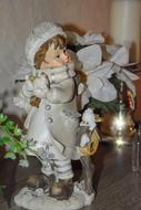 vintage Figurine of child Girl in winter clothing, christmas decoration