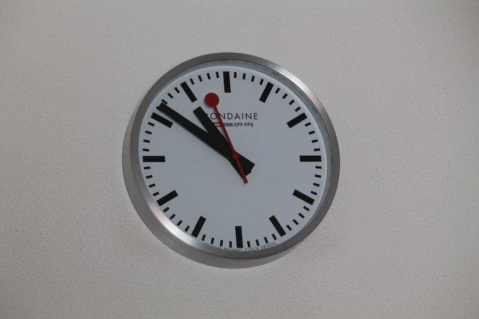 clock with big hands on the wall