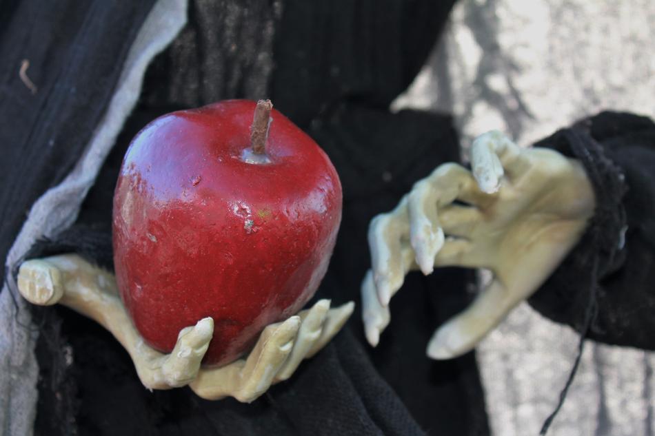 skeleton with an apple in his hand