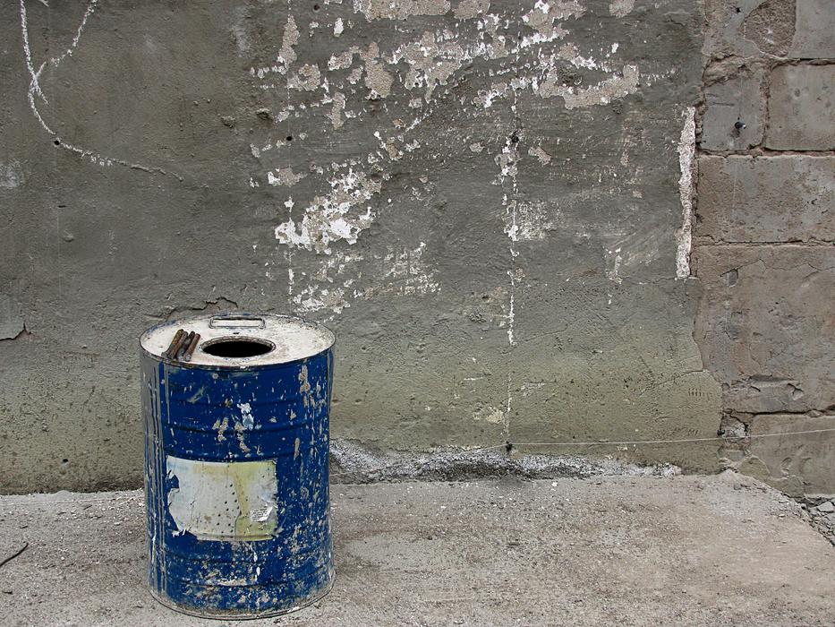 old iron barrel by the wall