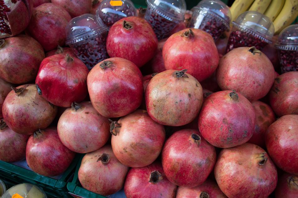 ripe pomegranates in a box at the market