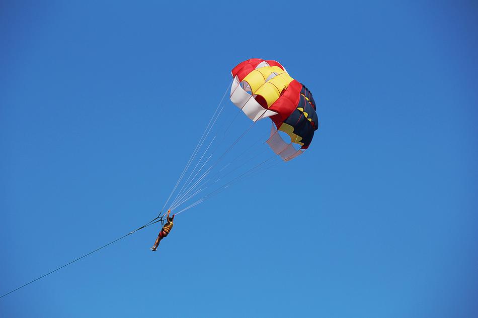 man with a parachute in the sky