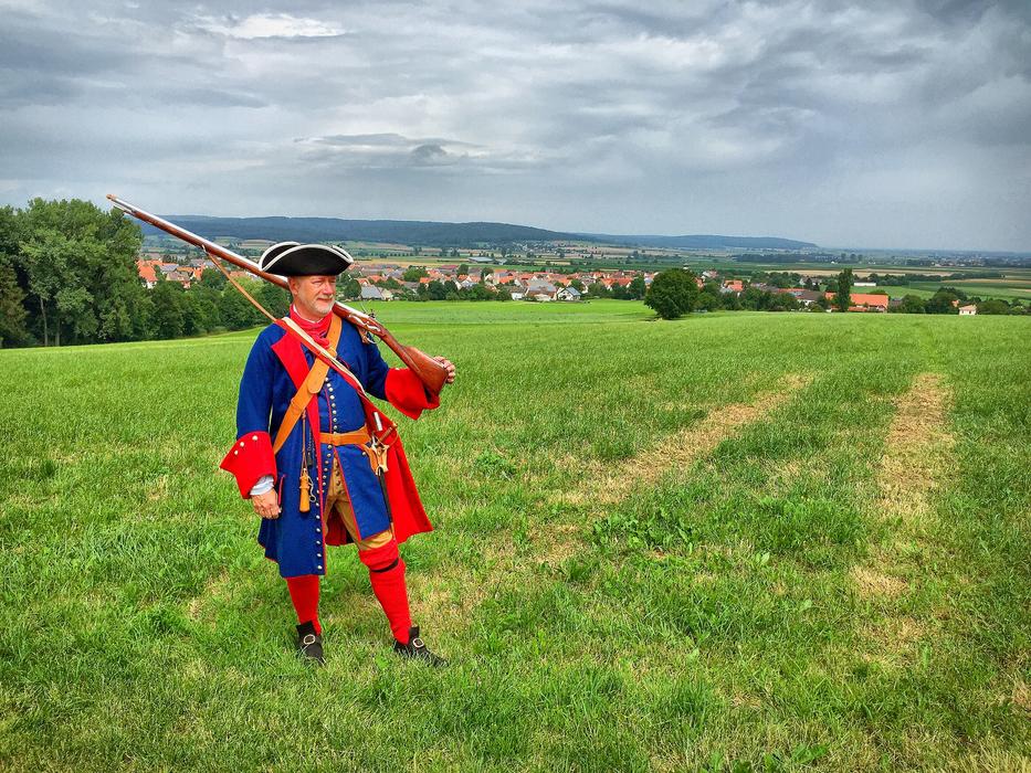 A funny clown in a green field