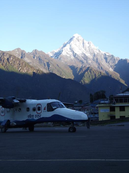 plane against the mountains