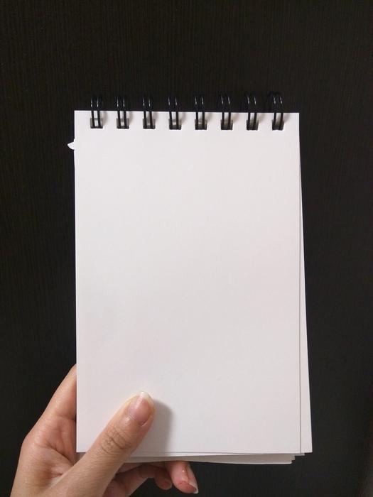 paper in the hand of man