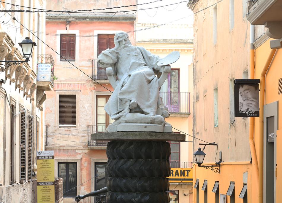 sculpture of a man on a column
