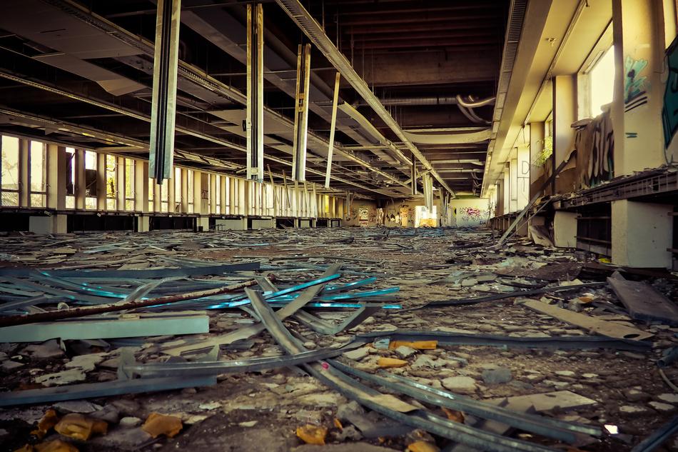 Old, abandoned factory with columns and graffities