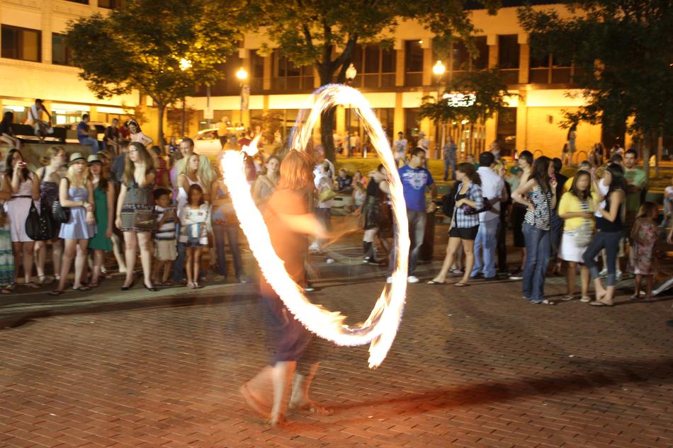 Person, doing beautiful fire snow, in the long exposure, with the spectators