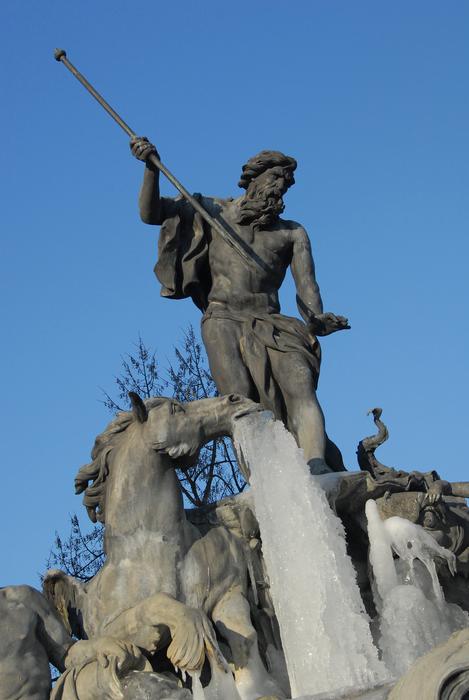 an unusual statue on a blue background