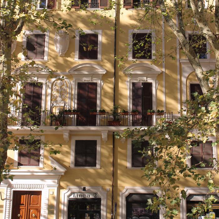 architecture of rome in the shade of trees